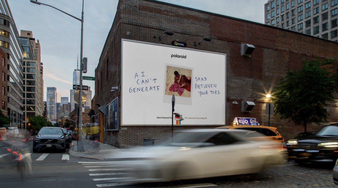 Polaroid Ad on a brick wall